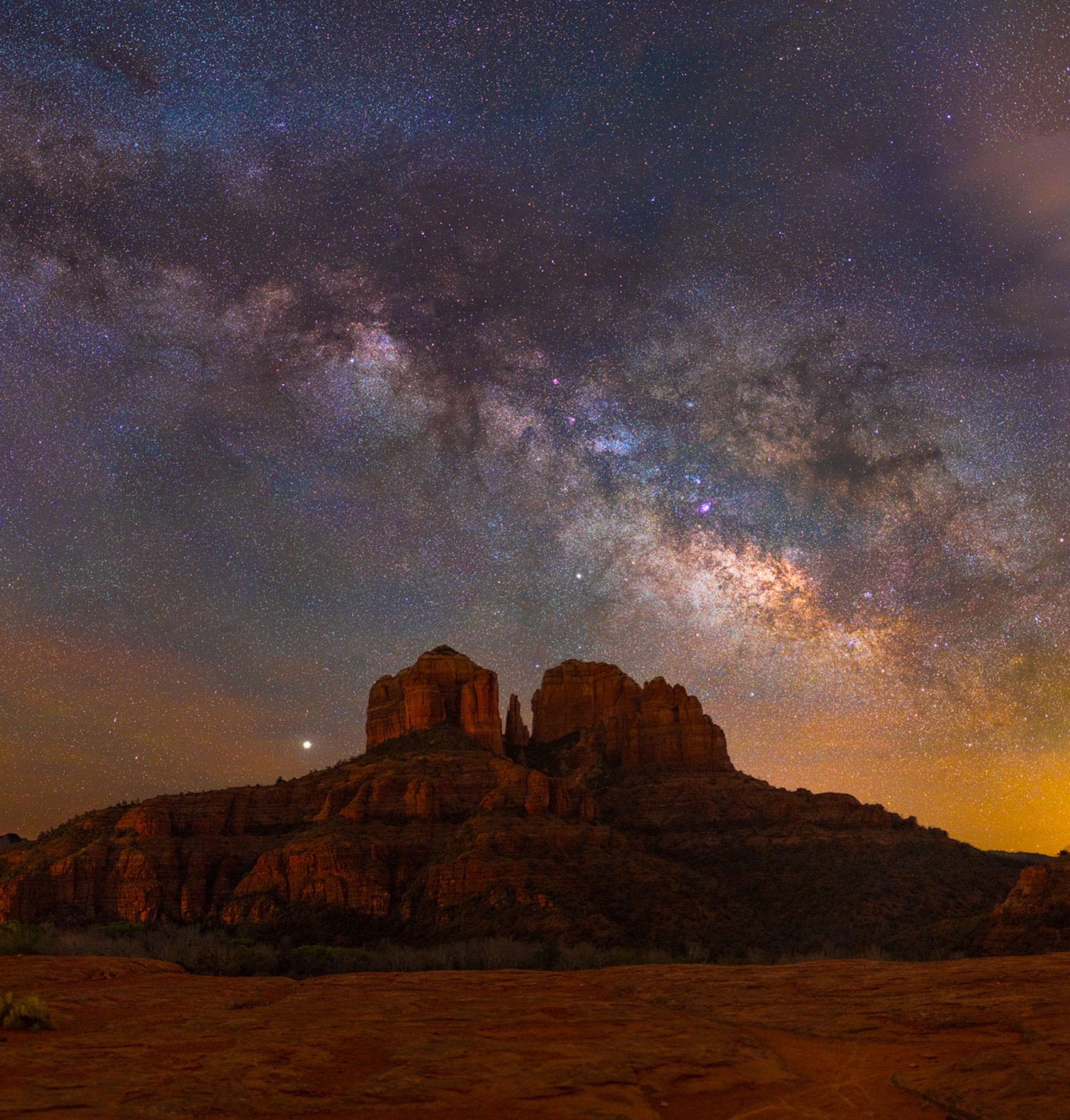 The Milky Way arching above Cathedral Rock in Sedona, Arizona