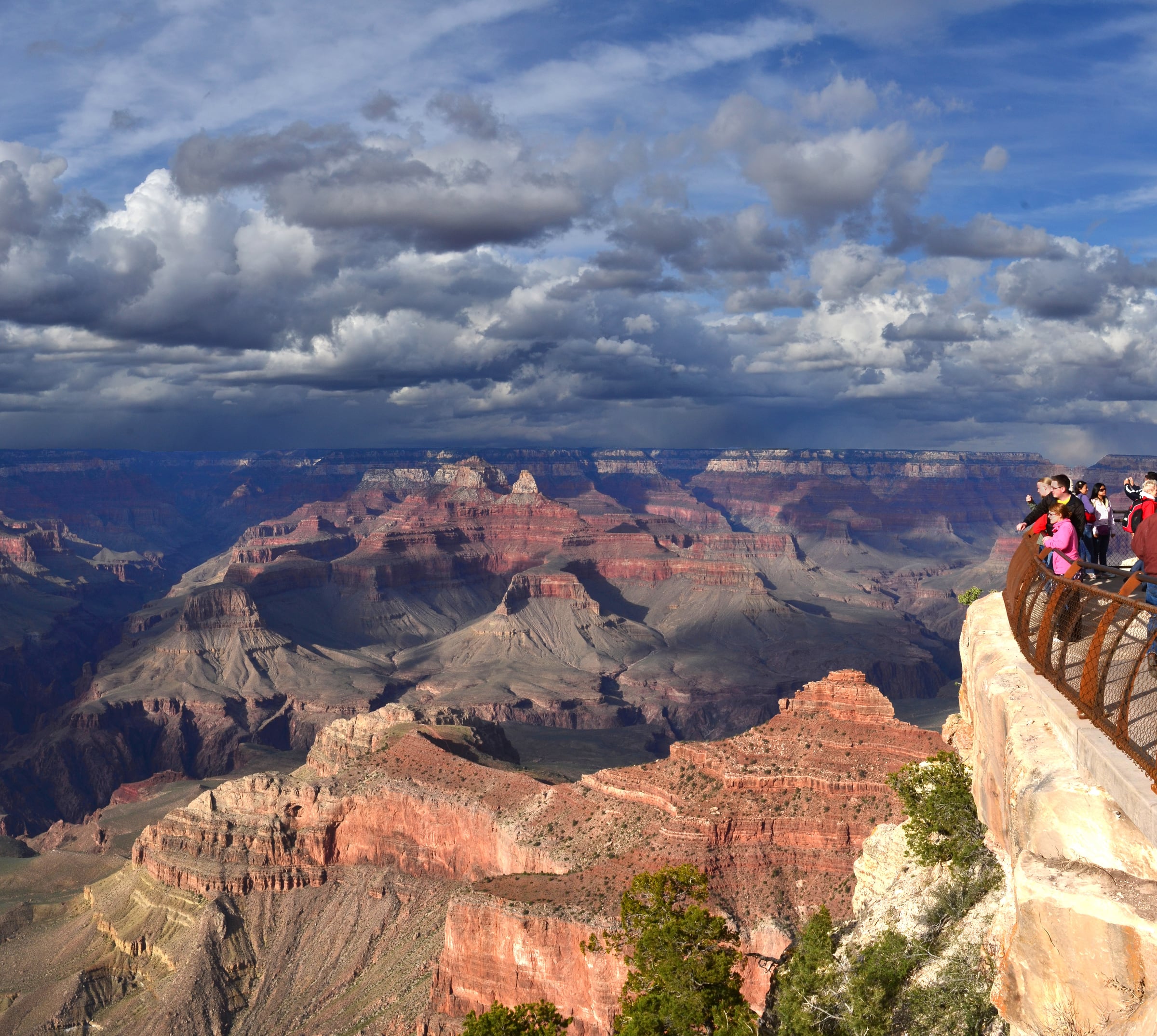 The Grand Canyon viewed from Mather Point on the South Rim beneath a dramatic spring sky