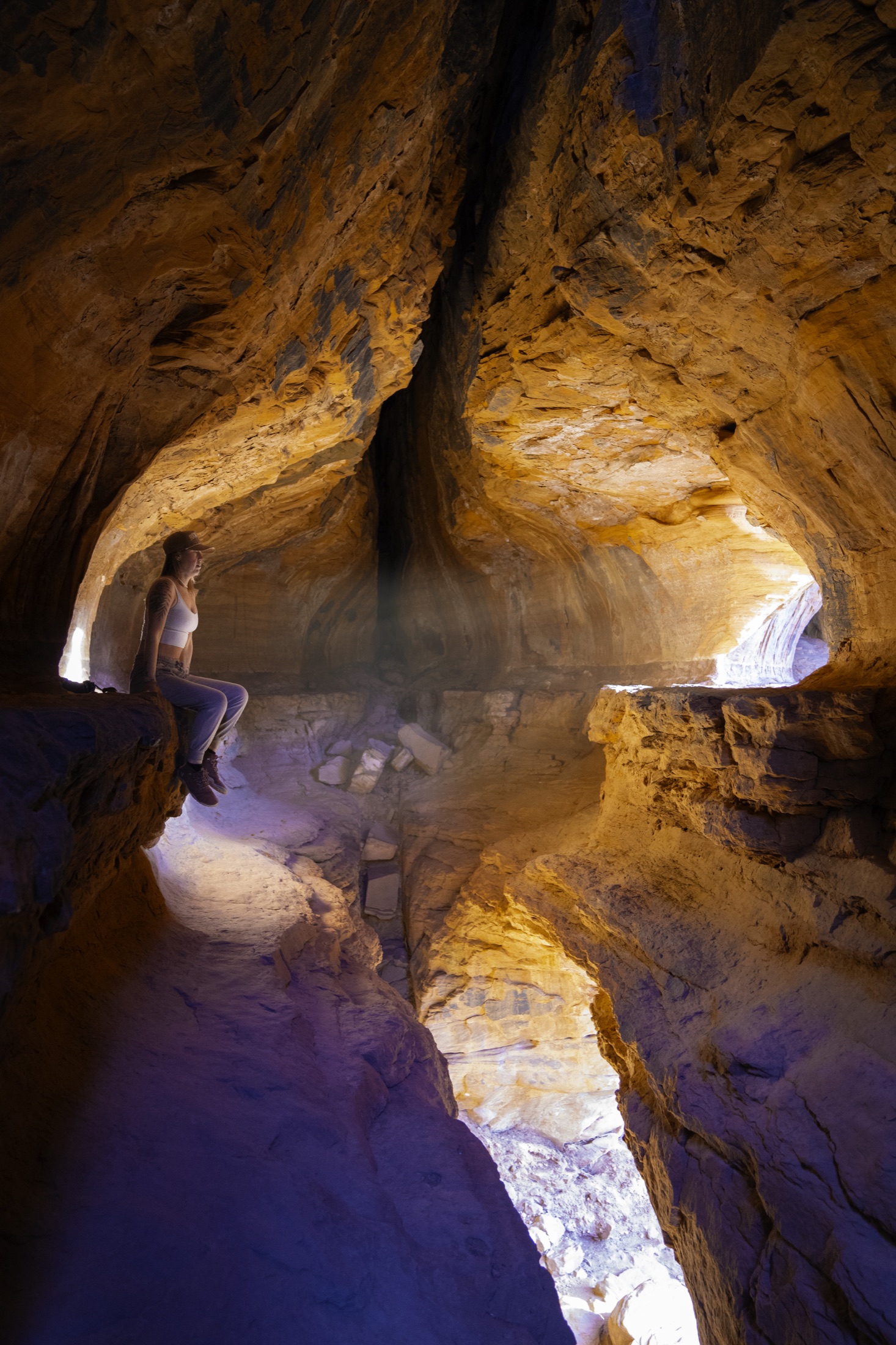 Warm light filling a red-rock cave along a Sedona trail