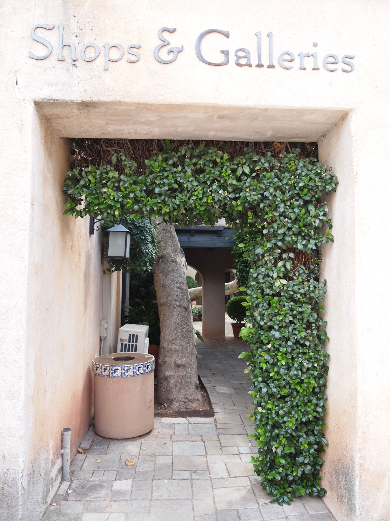 An ivy-framed entrance to the shops and galleries at Tlaquepaque in Sedona